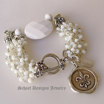 White opal & silver chain bracelet with white agate focal bead & fleur de lis charms | online jewelry boutique | Schaef Designs Signature artisan handcrafted Gemstone & pearl Jewelry | San Diego CA