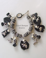 Schaef Designs sterling silver endangered species african animal, trade beads & black tourmaline charm bracelet | Upscale online jewelry boutique gallery | Schaef Designs Totem Animal Shaman Jewelry | San Diego, CA 