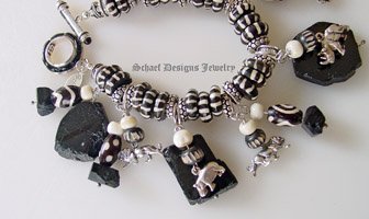  Schaef Designs sterling silver endangered species african animal, trade beads & black tourmaline charm bracelet | Upscale online jewelry boutique gallery | Schaef Designs Totem Animal Shaman Jewelry | San Diego, CA