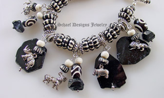  Schaef Designs sterling silver endangered species african animal, trade beads & black tourmaline charm bracelet | Upscale online jewelry boutique gallery | Schaef Designs Totem Animal Shaman Jewelry | San Diego, CA