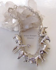 Susan Cummings sterling silver endangered species african animal charm necklace | Upscale online jewelry boutique gallery | Schaef Designs Totem Animal Shaman Jewelry | San Diego, CA 