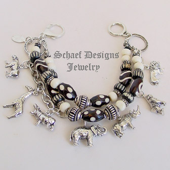  Schaef Designs black & white trade bead & sterling silver endangered species african animals 3 strand white coral charm bracelet | New Mexico