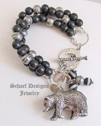 Susan Cummings large bear charm on Schaef Designs sterling silver & black wooden bead 
charm bracelet | New Mexico 